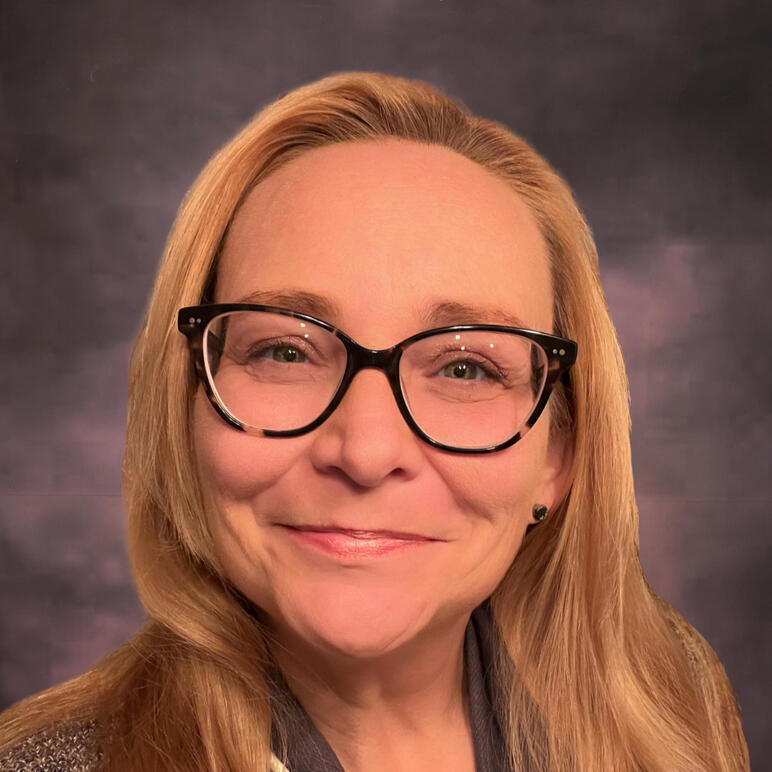 Roxann Grover O'Day, MA photo of a woman wearing glasses